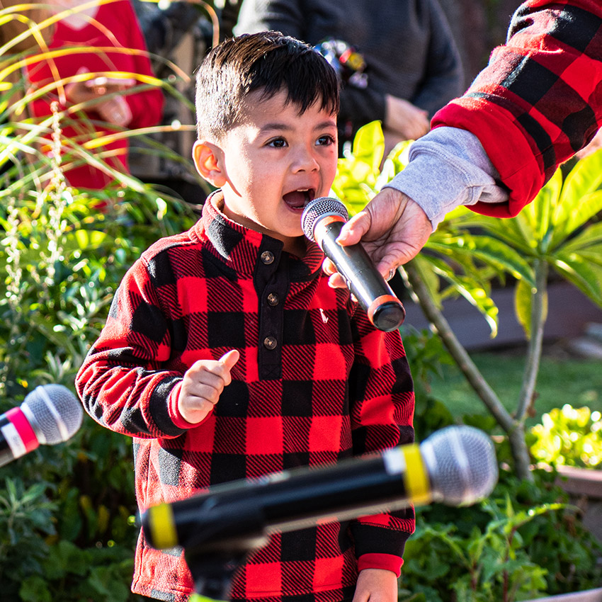 Little Angels Christmas Performance boy rocking out